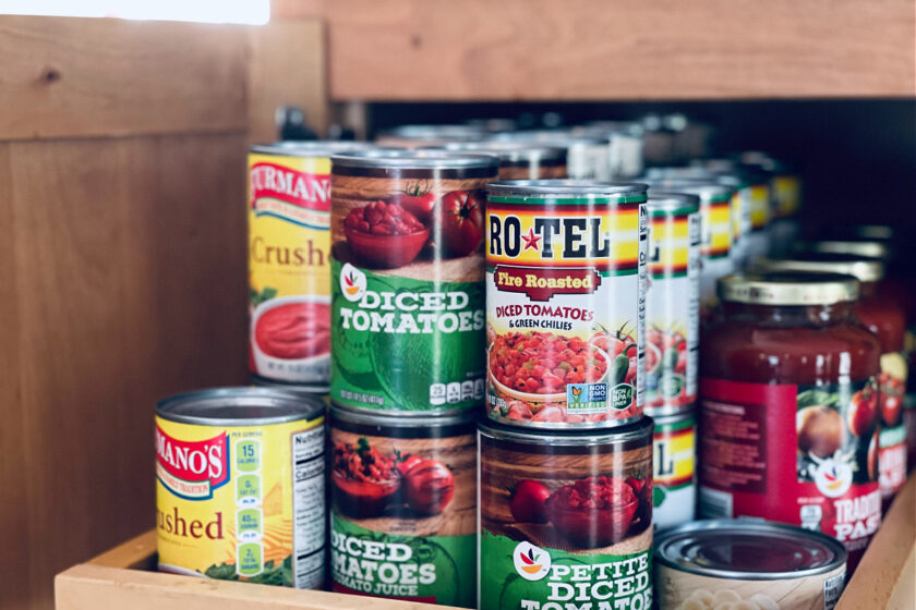 minimalist pantry shelf full of canned goods.