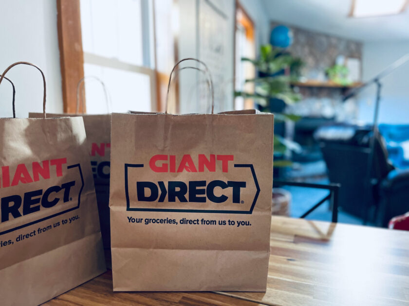 giant direct grocery bags sitting on kitchen table.