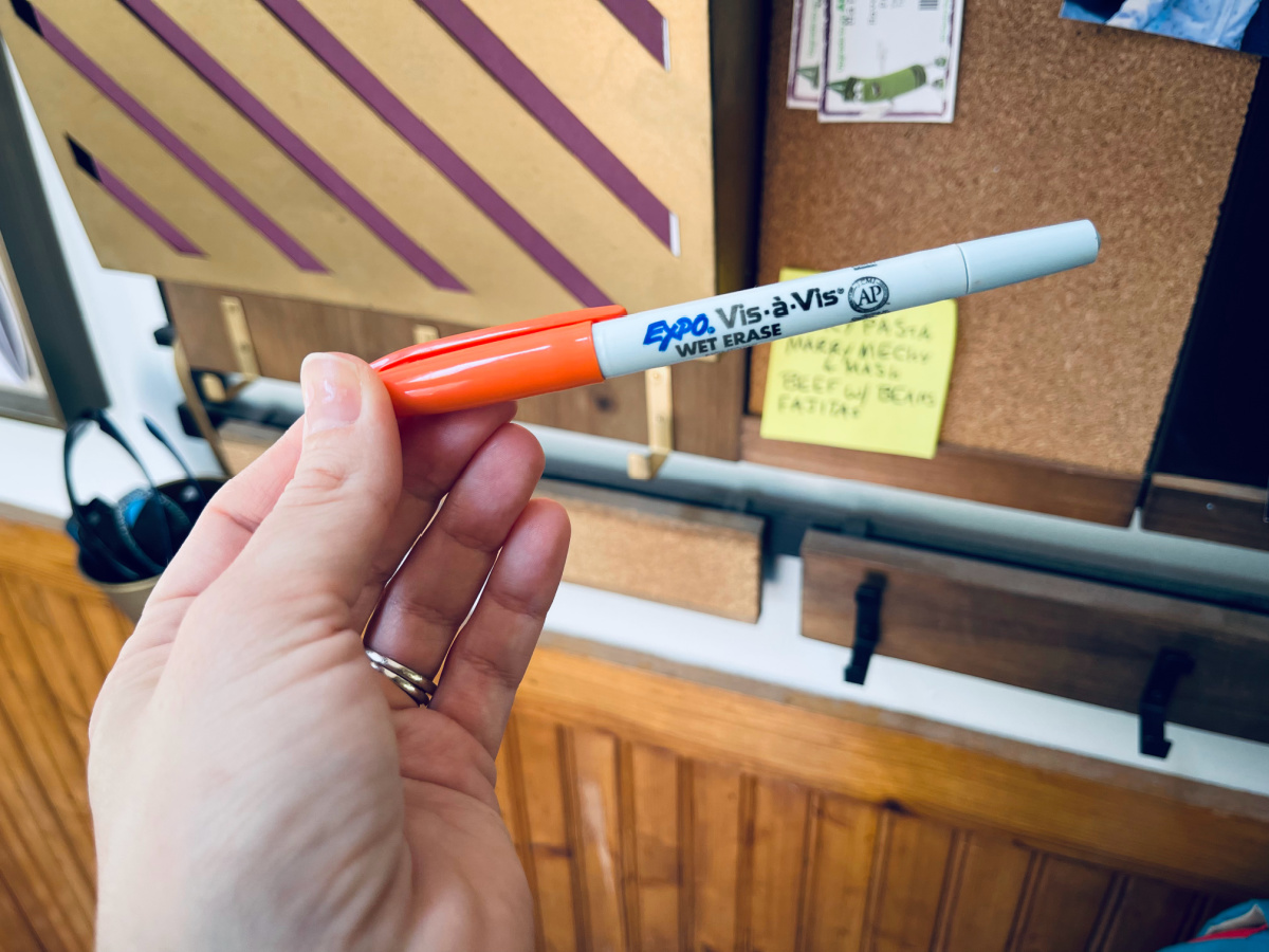 wet erase marker close-up in front of 1thrive wall organizer.