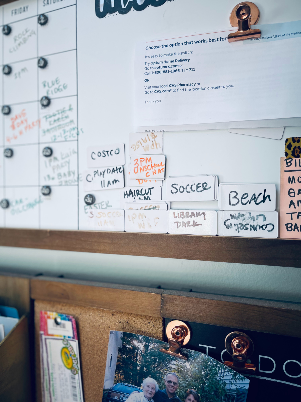 dry erase magnets with events written on them on white board of 1thrive wall organizer.