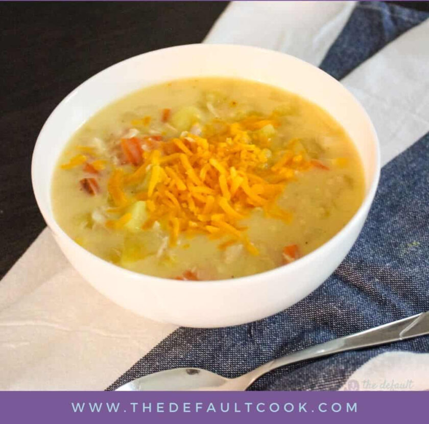 crockpot chicken potato chowder in bowl on top of striped napkin.