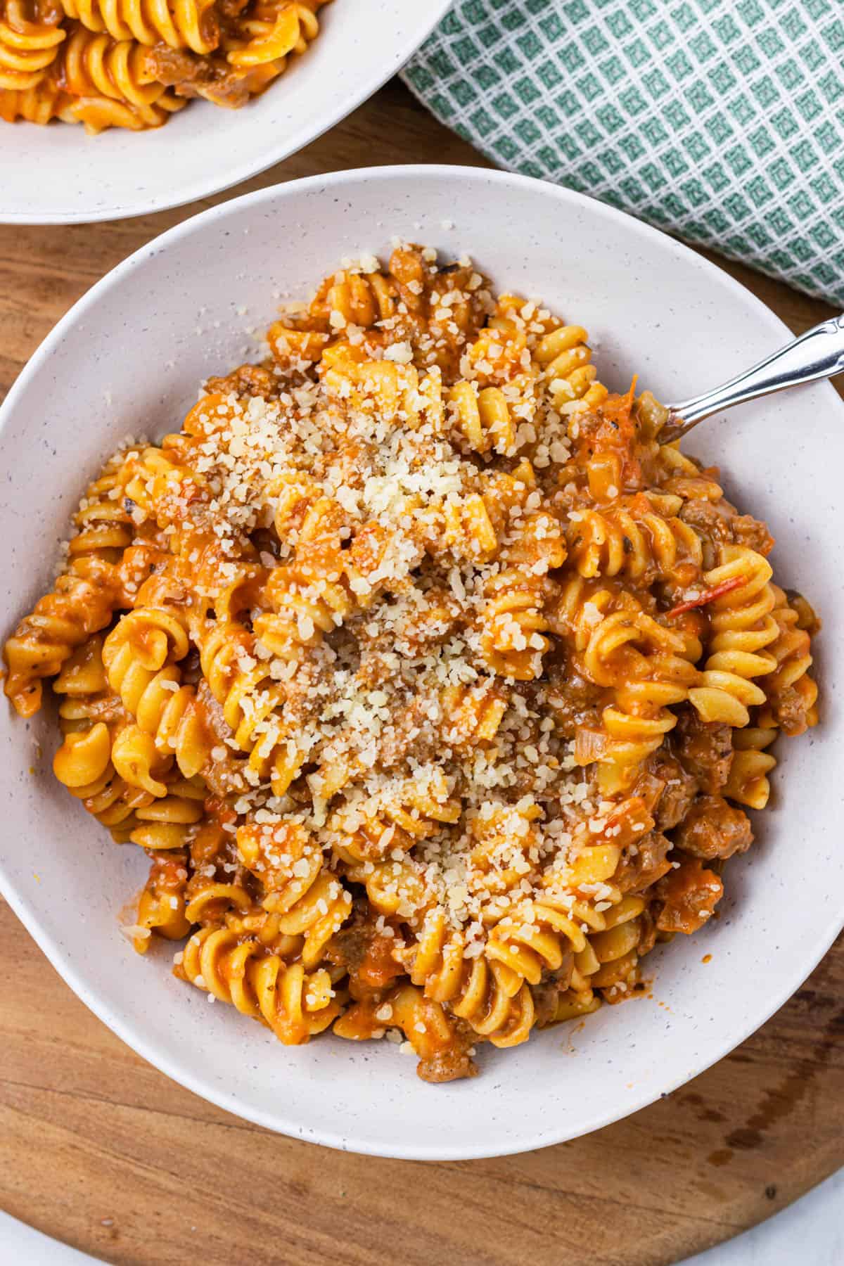 white bowl with a serving of one pot creamy ground beef pasta.