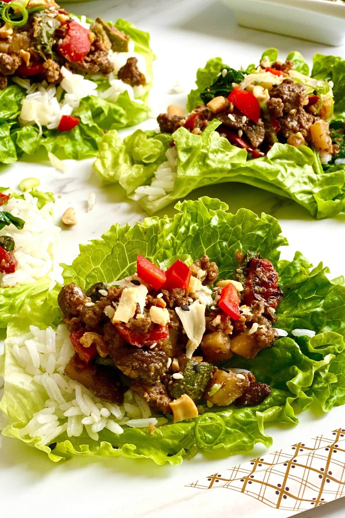 ground beef lettuce wraps on marble countertop.