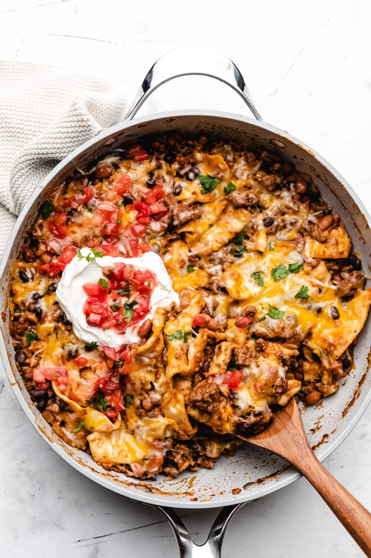 ground beef burrito skillet with sour cream and salsa.