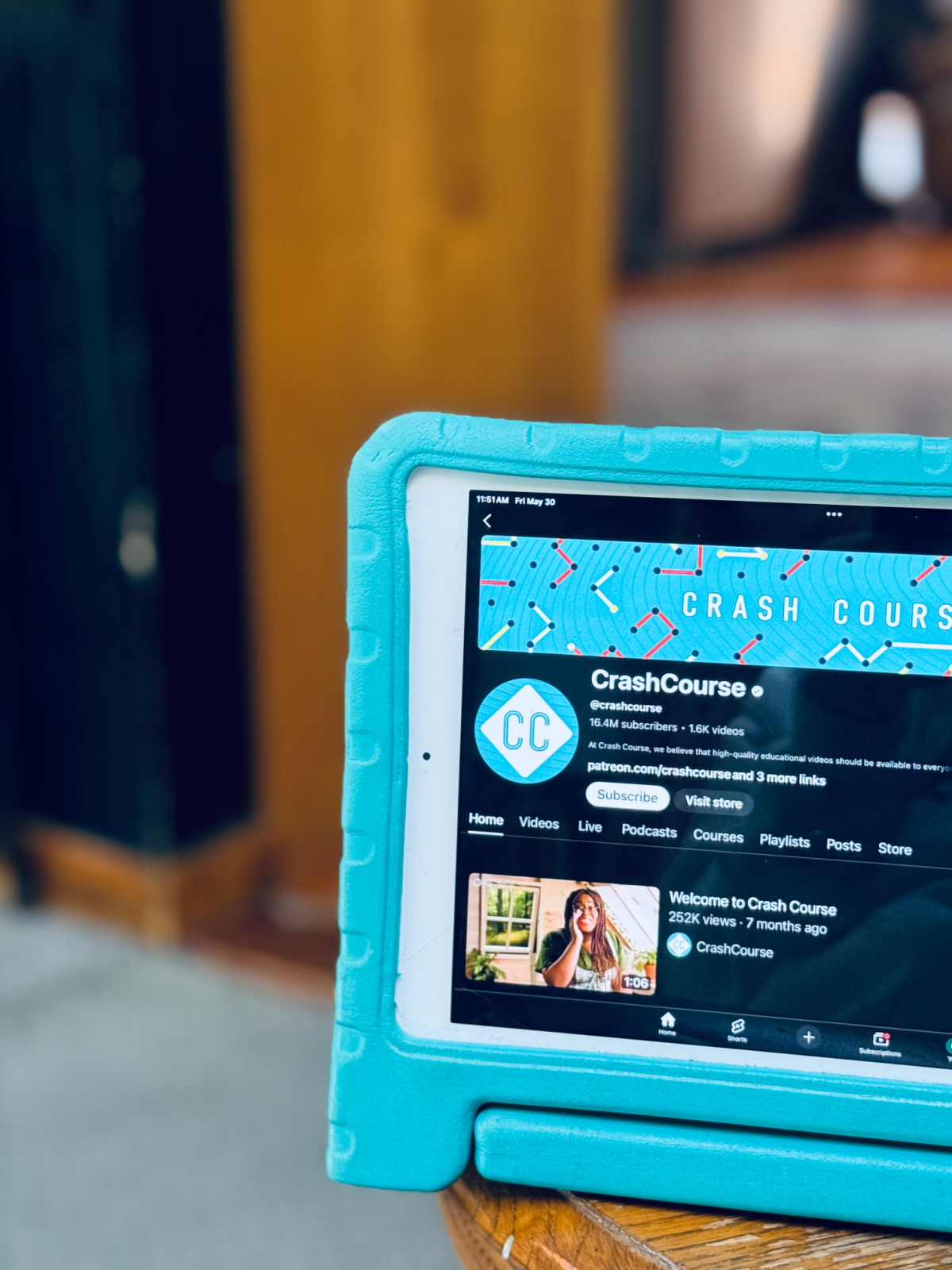 ipad with Youtube's Crash Course channel homepage.
