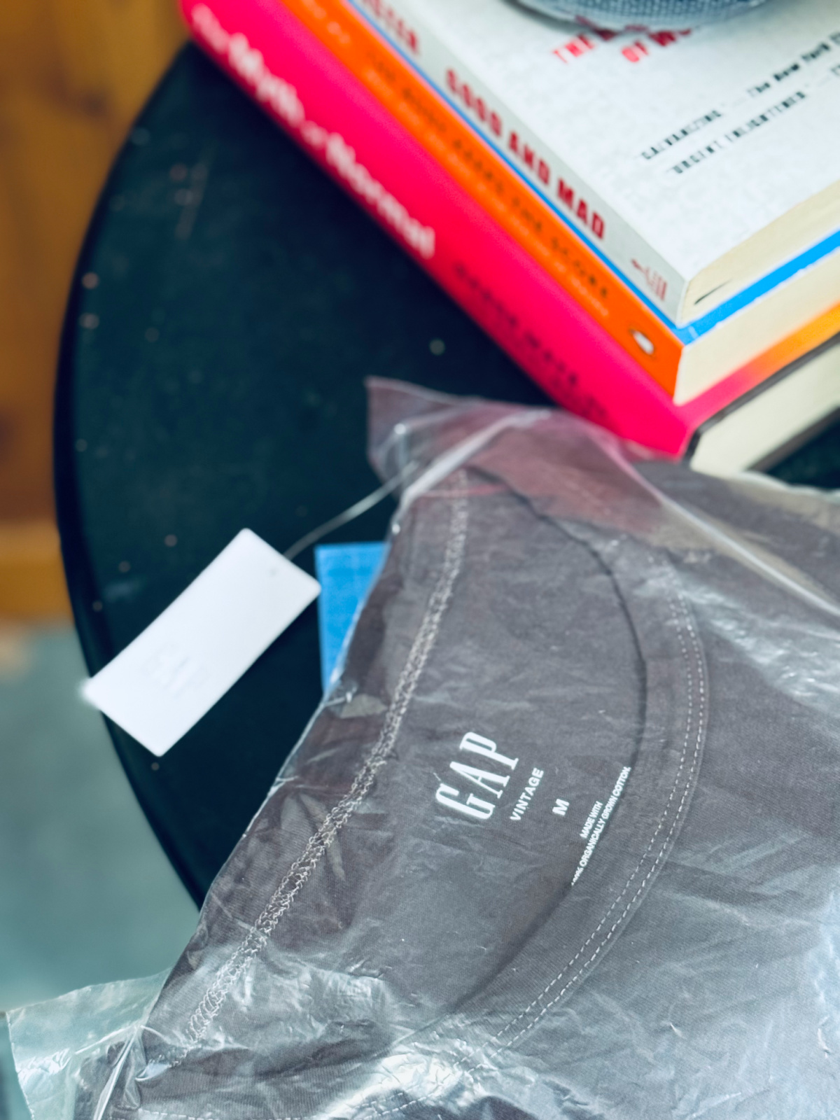 a new t-shirt from the gap, in wrapping on table.