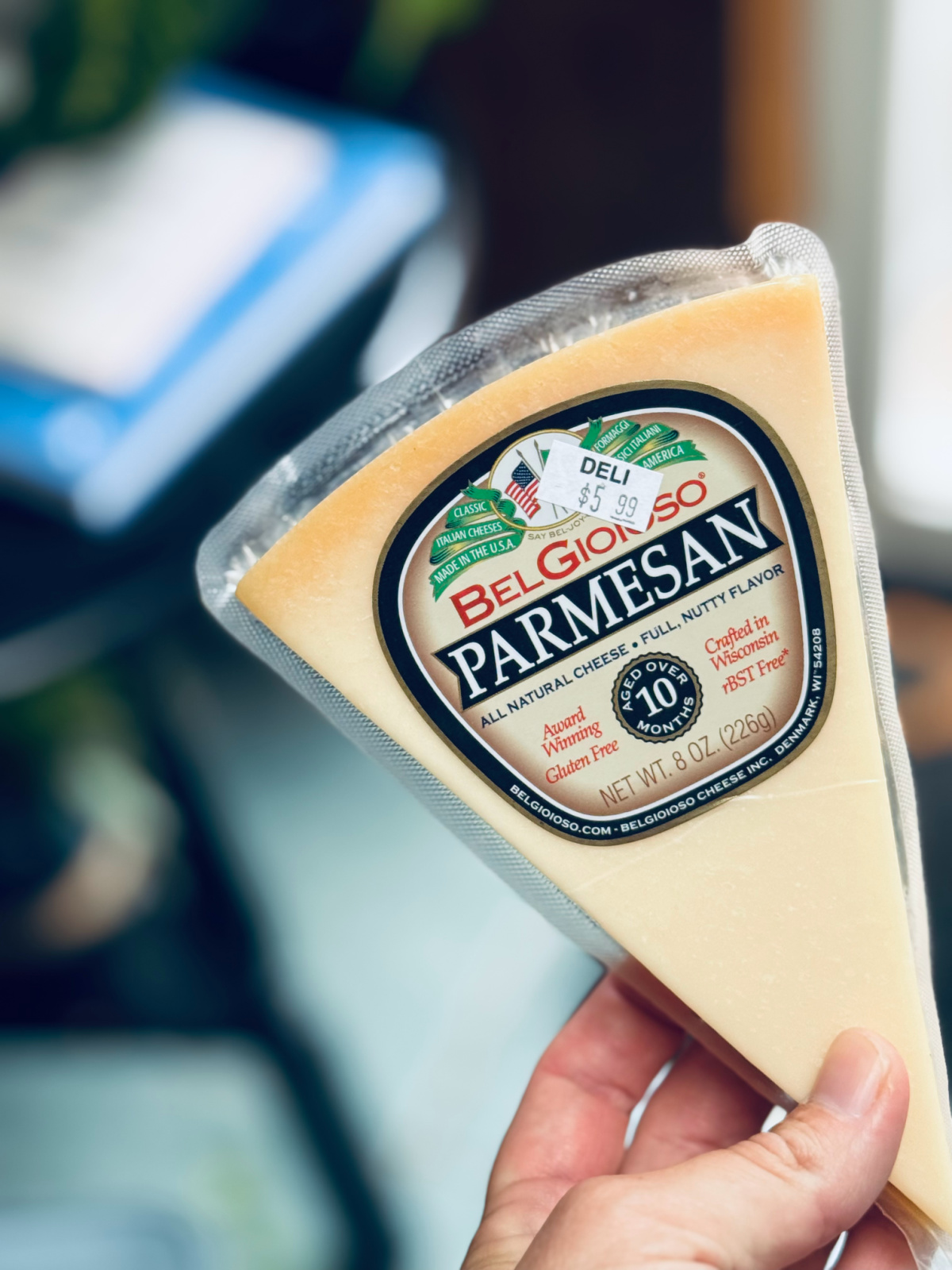 Wedge of Pamesan cheese close-up.