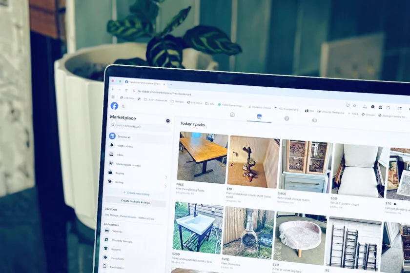 facebook marketplace shown on laptop, shopping for second hand gifts concept.