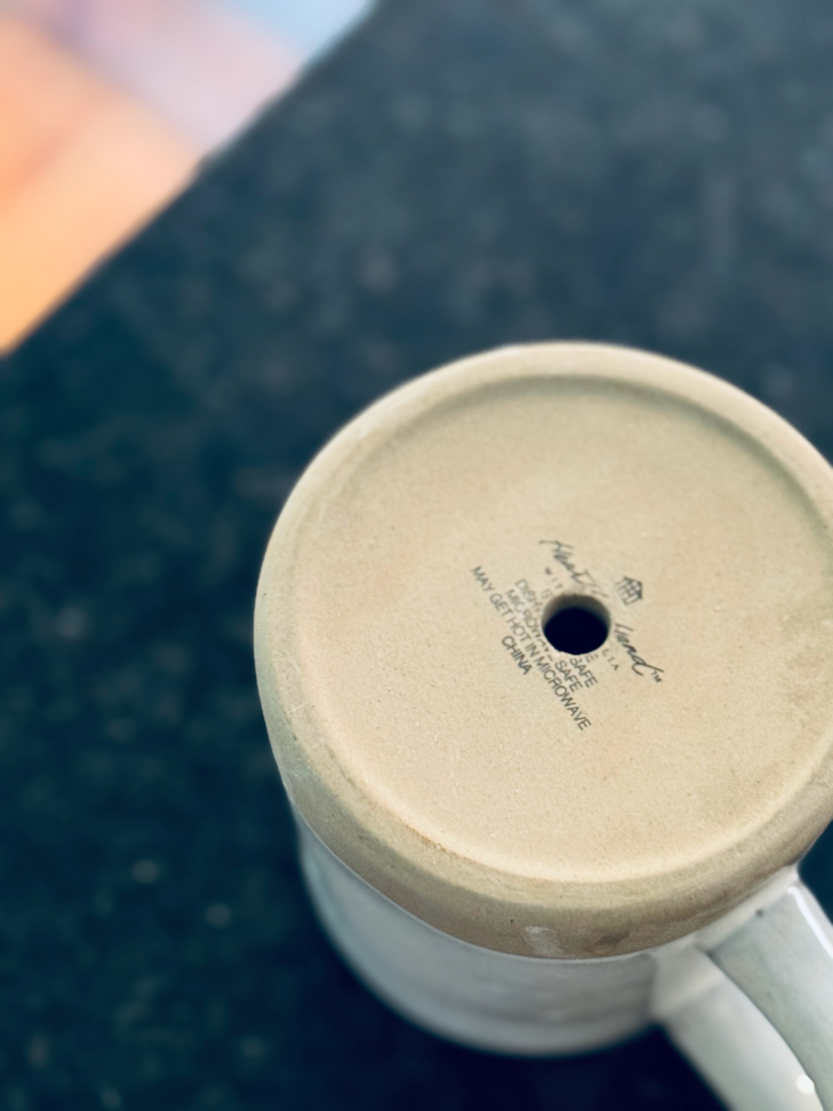 end result - drainage hold in old mug turned planter.