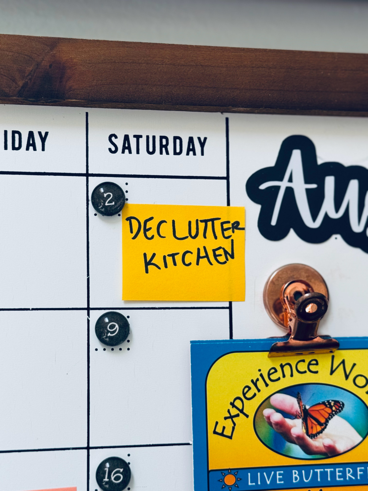 calendar with yellow post-it note saying, "Declutter Kitchen"