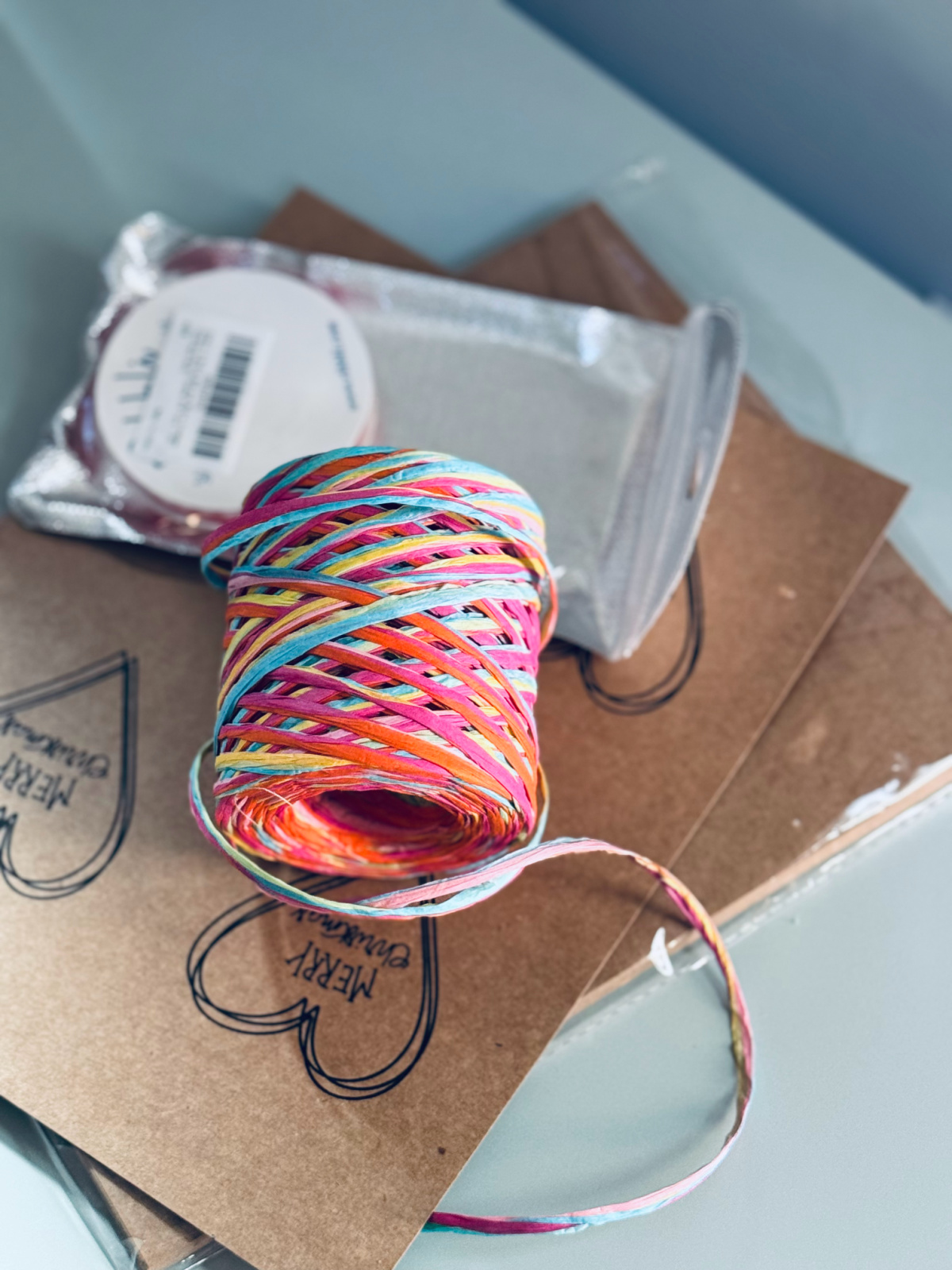 gift tags and colorful ribbon on countertop.
