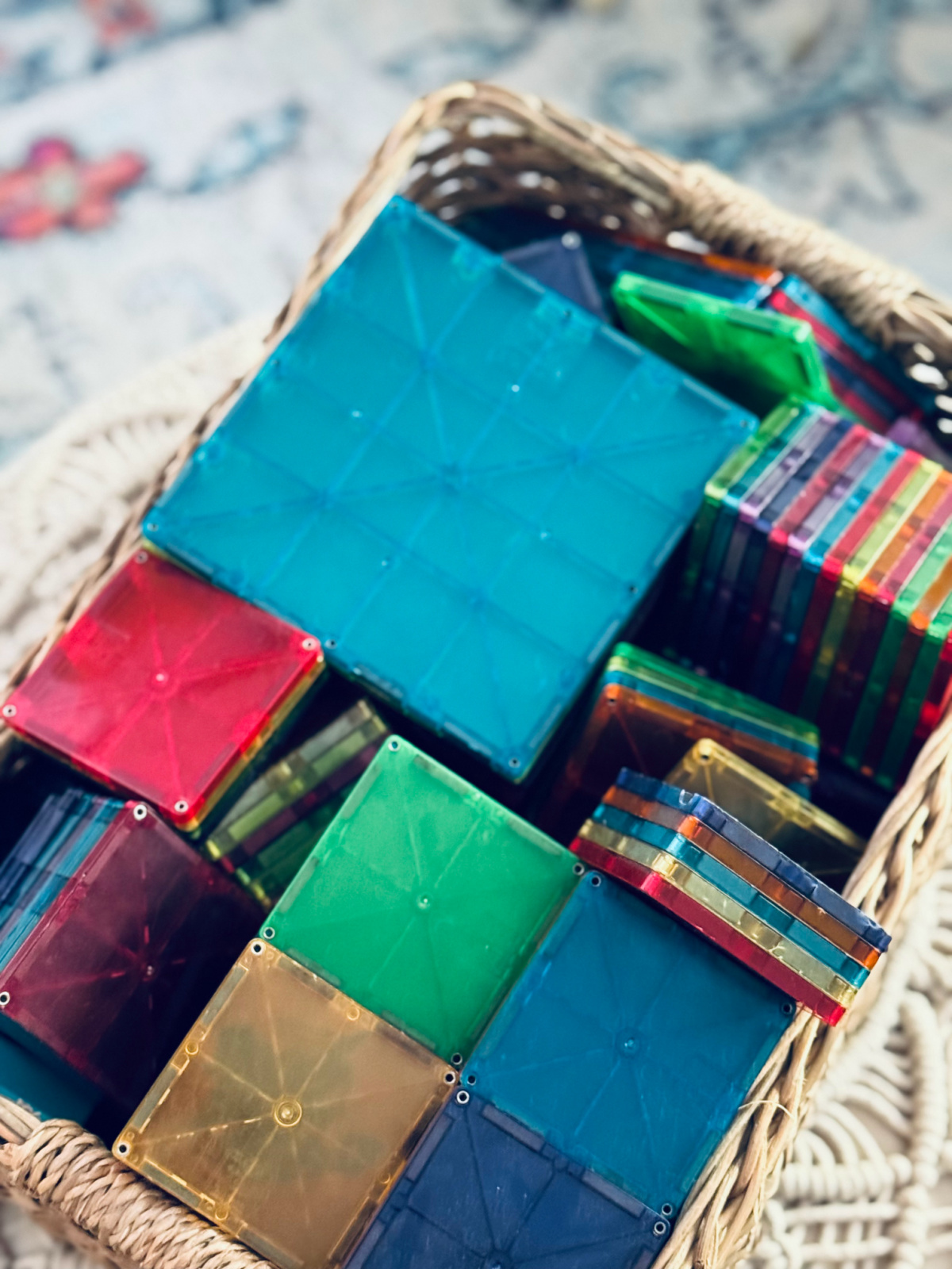 colorful Magnatiles in a basket.