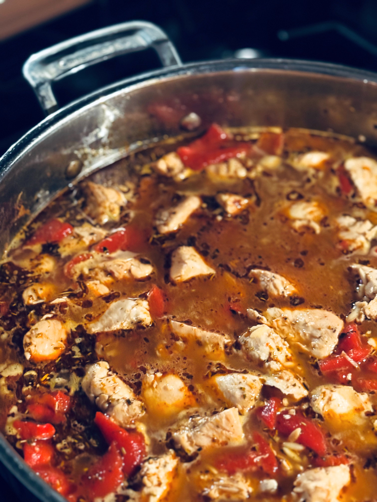 roasted red pepper chicken orzo in process, about halfway through cooking