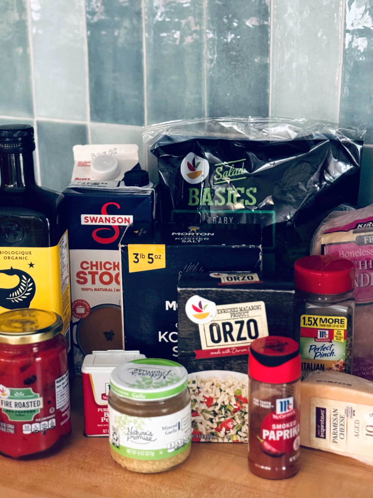 ingredients for creamy red pepper chicken orzo on countertop. 