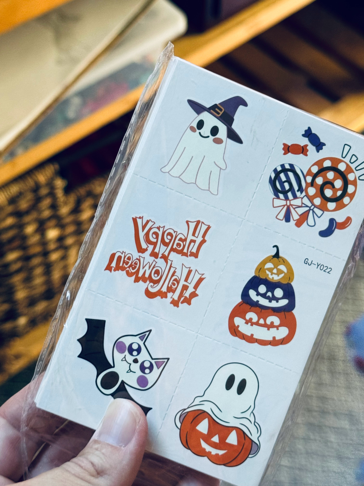 full sheet of glow in the dark Halloween tattoos close-up.