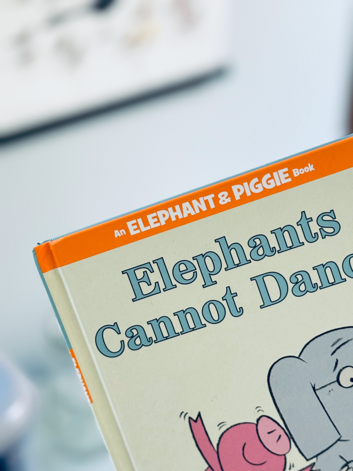 Elephant and Piggie book "Elephants Cannot Dance" in focus.
