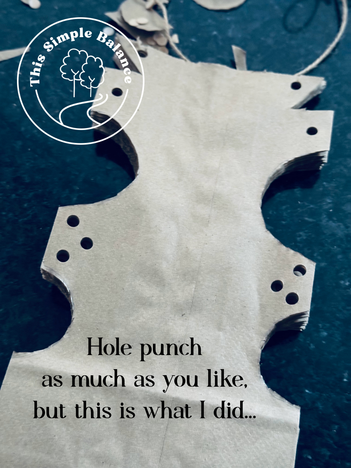 cut and hole punched demonstration of large paper bag stars.