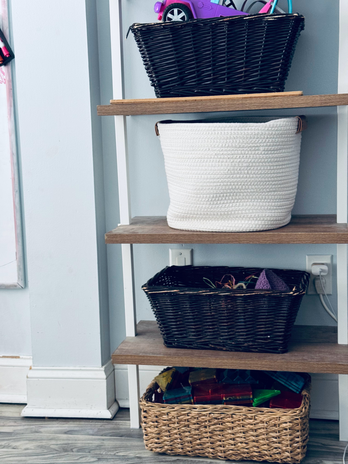 various different baskets on shelves with toys.