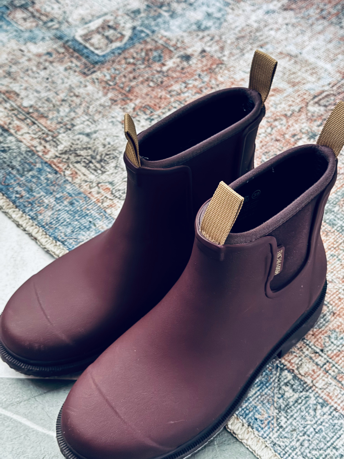 burgundy Merry People rain boots close up.
