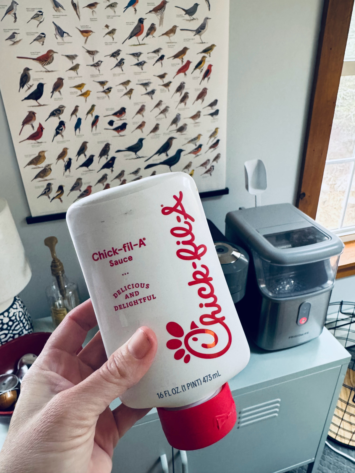 Chick Fil A Sauce bottle in focus.