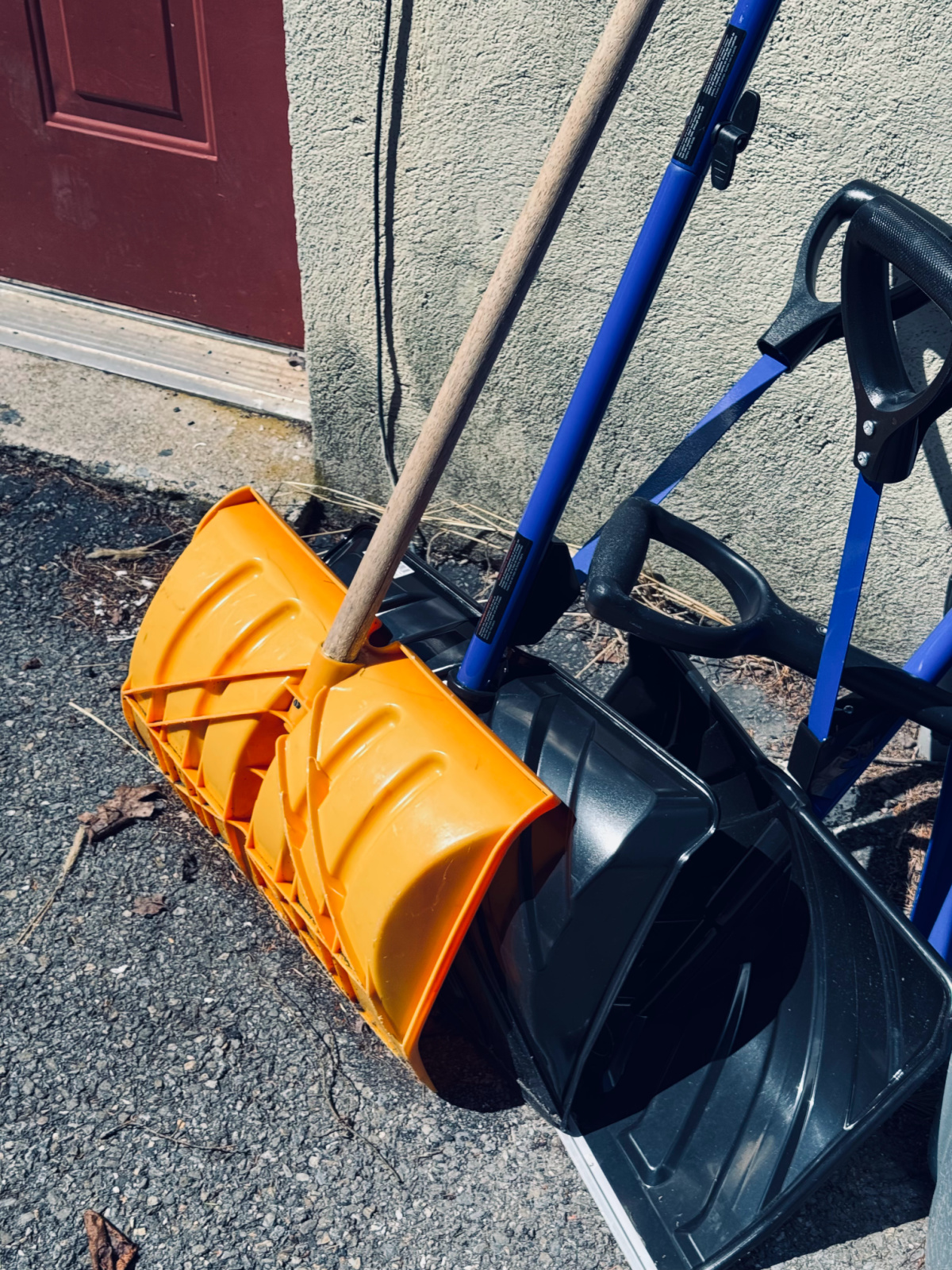 snow shovels outside door.
