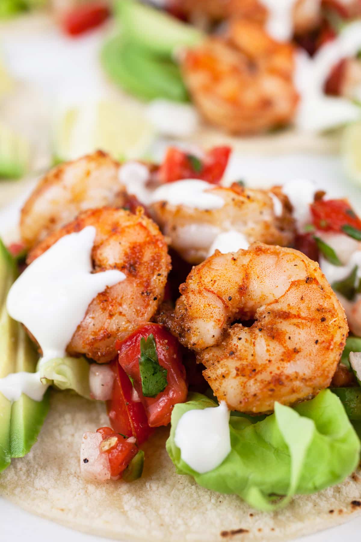 shrimp taco with lime crema and pico de gallo.