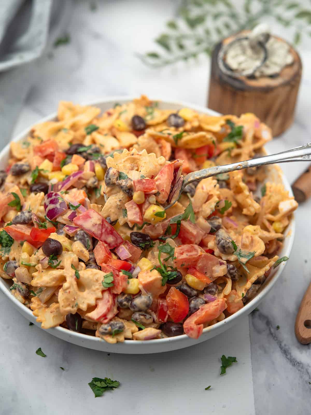 chipotle pasta salad in white bowl.