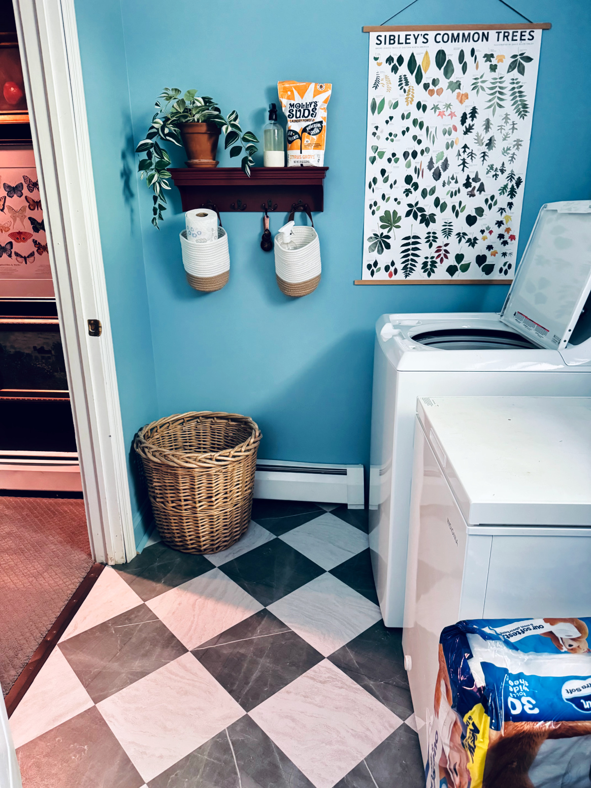 finished laundry room with peel and stick tiles.
