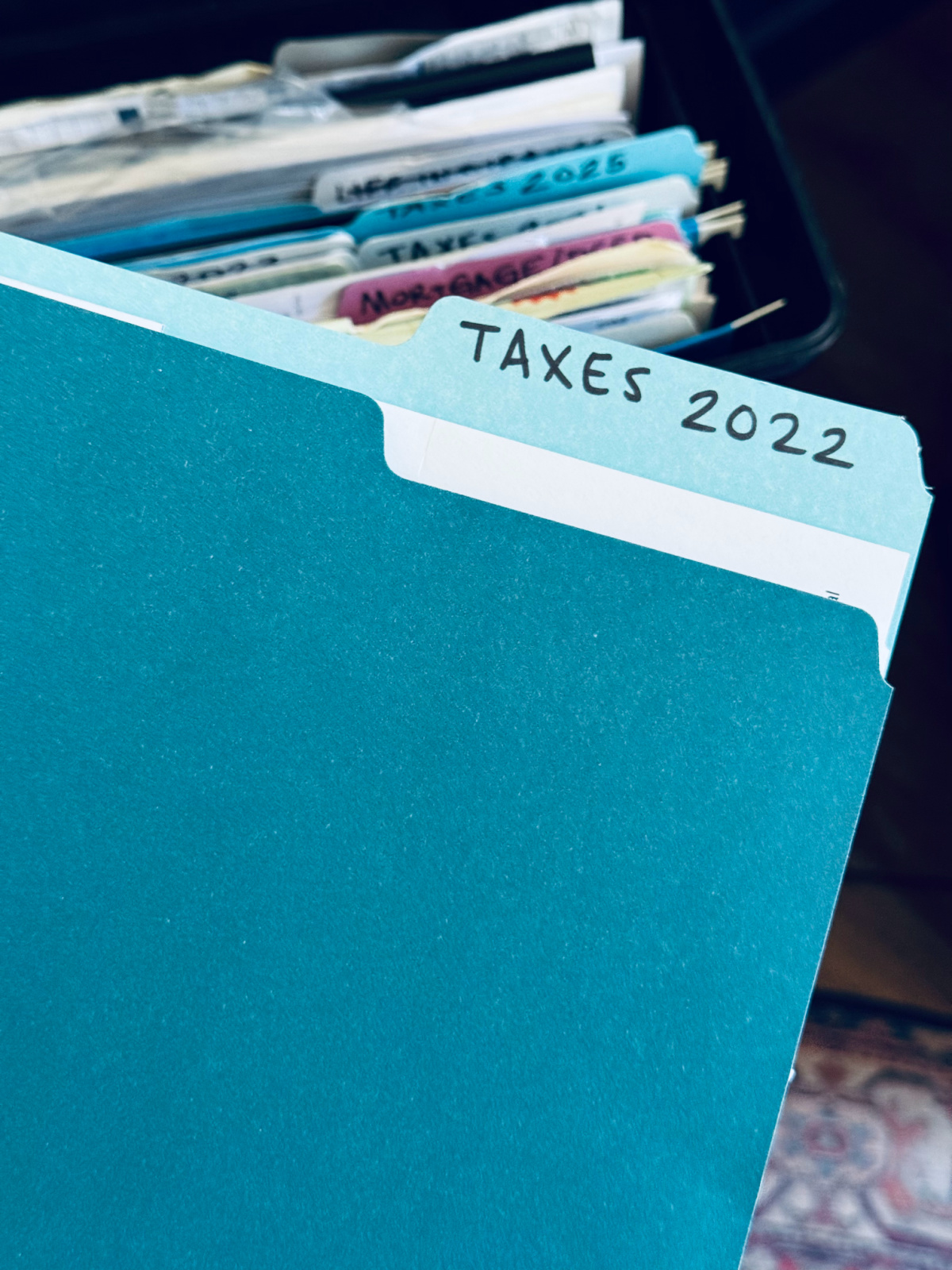 blue folder with "Taxes 2022" label.