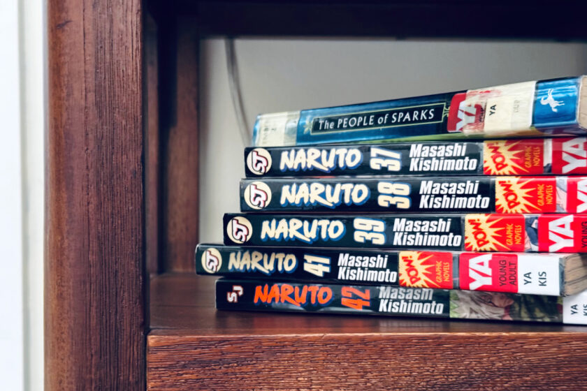 Naruto Manga books on shelf.