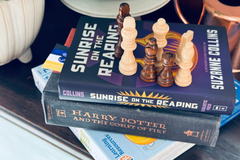 sunrise on the reaping, harry potter, board game and chess pieces representing unschooling interests.