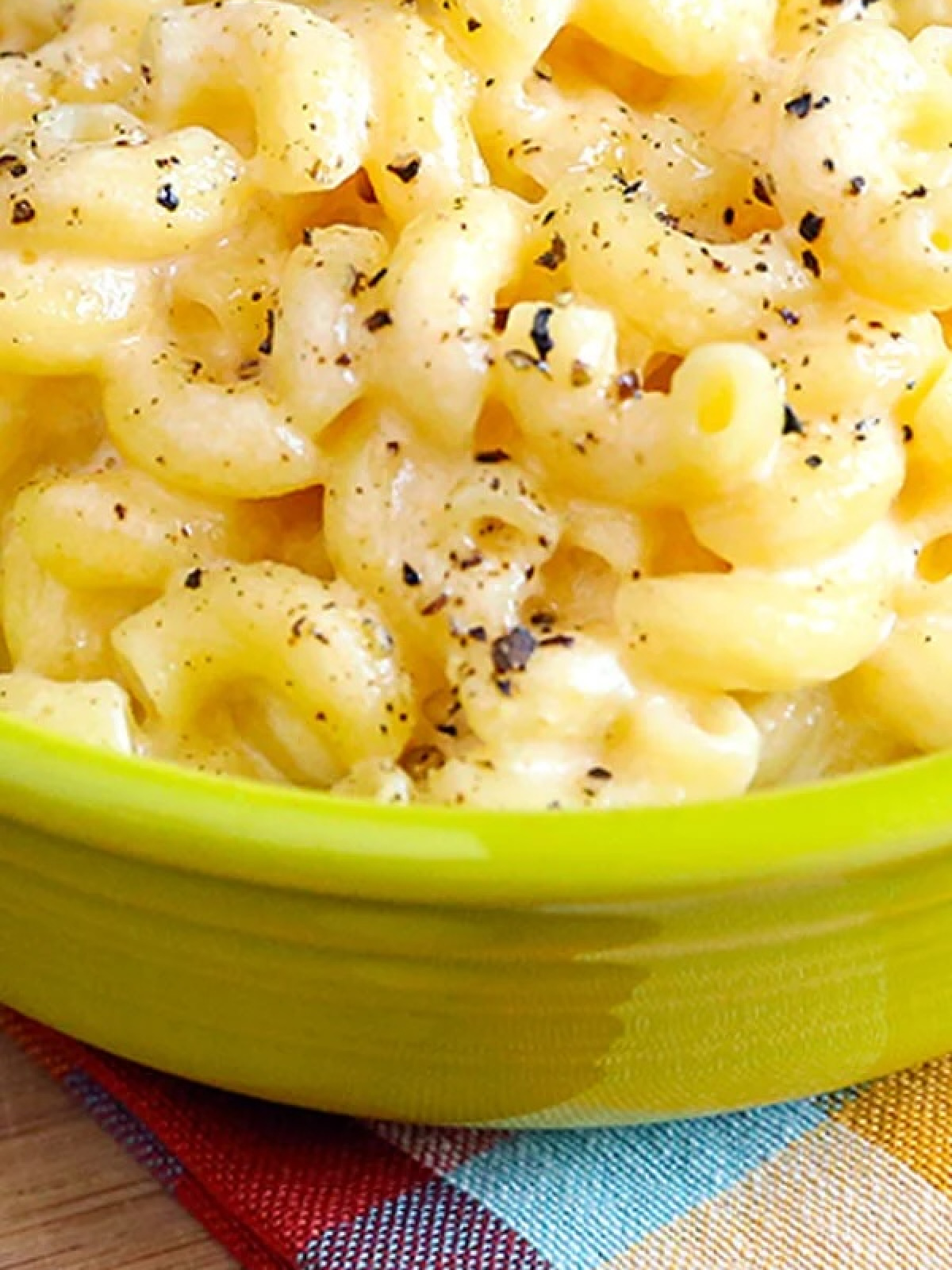 simple mac and cheese in lime green bowl.
