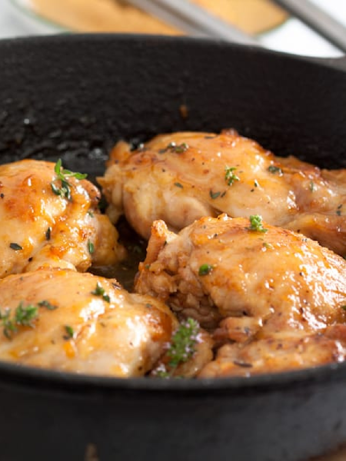 apricot ginger glazed chicken in skillet.