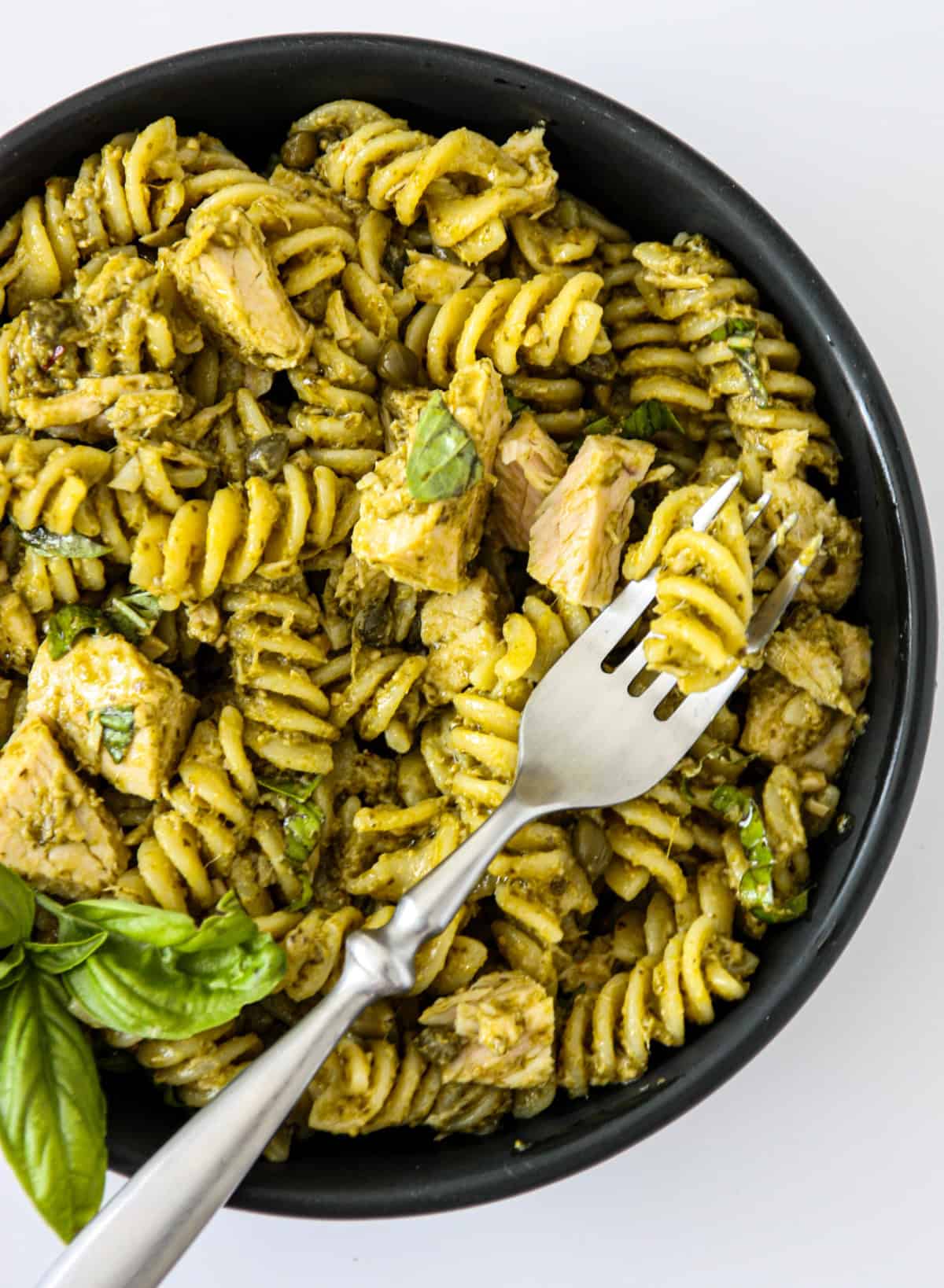 serving of tuna pesto pasta in bowl, lazy dinner concept.