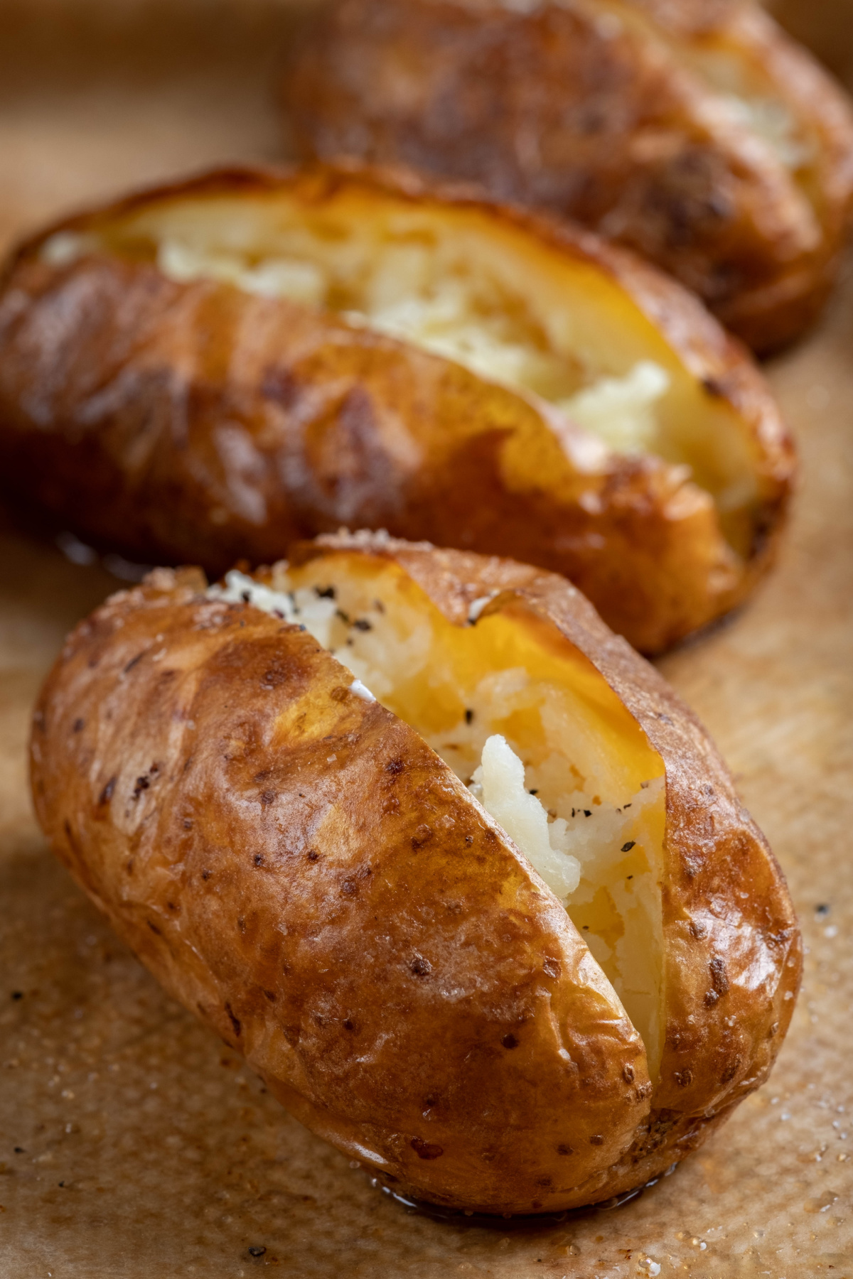baked potatoes on tray.