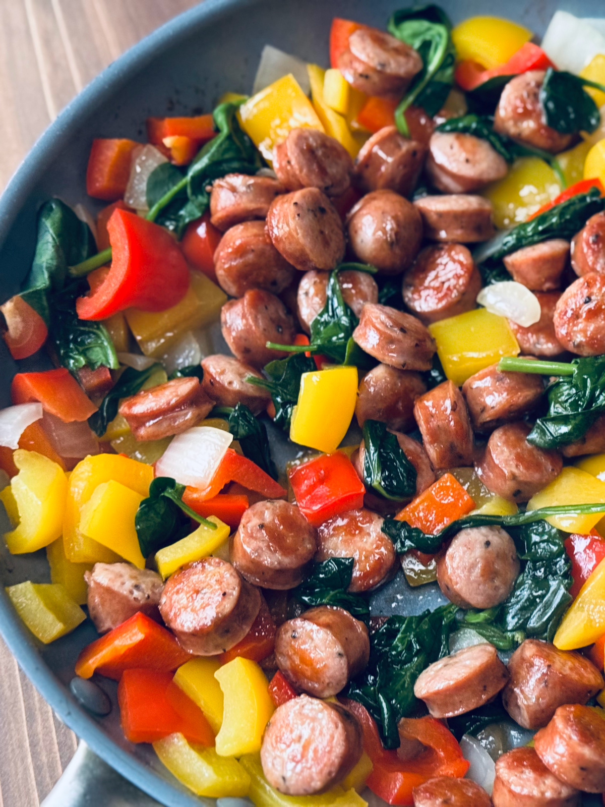 Costco chicken sausage stir fry in pan.