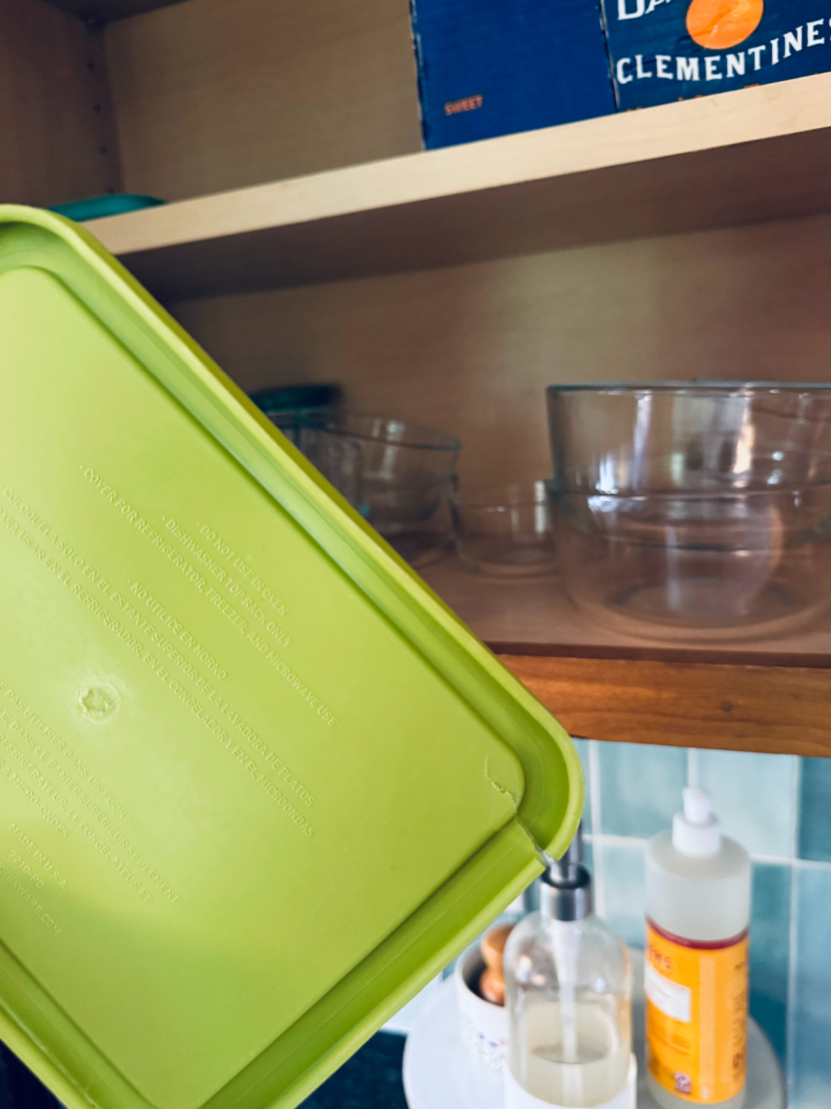 cracked pyrex food storage lid that needs to be decluttered and replaced.
