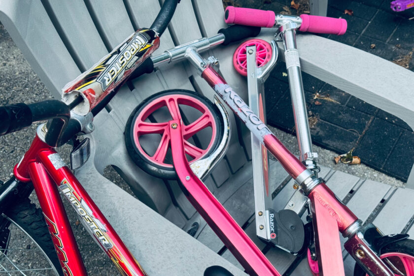scooters and a bike on outdoor furniture, representing august decluttering projects.